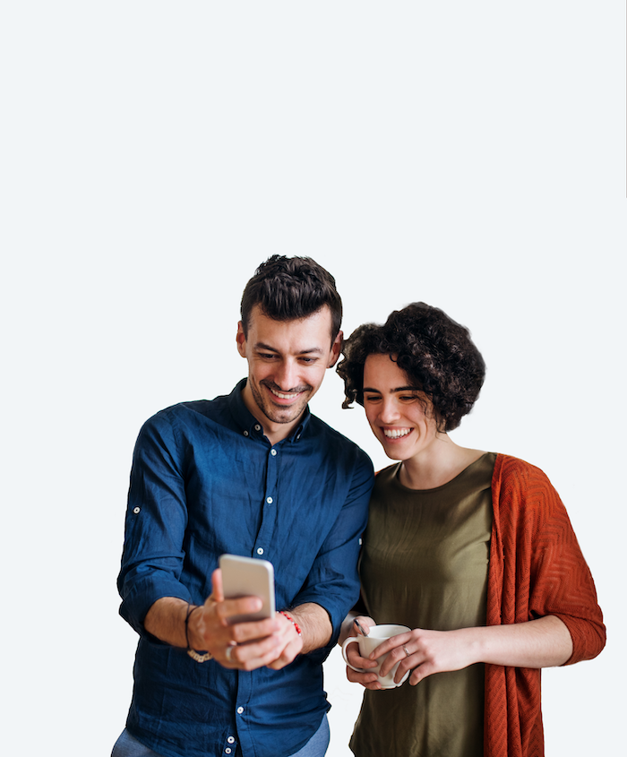 Couple looking at phone and smiling